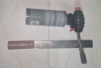 Fire torch and tool used during bee rescues